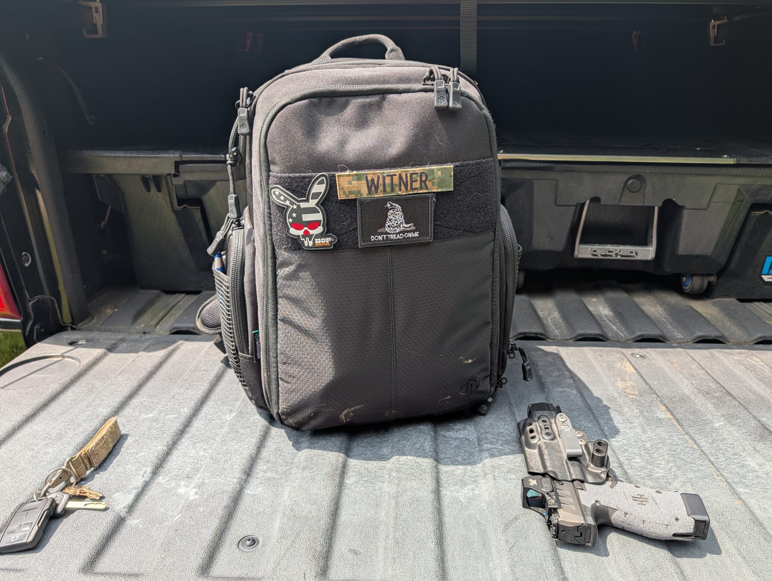 my pistol range bag on the tailgate of my truck