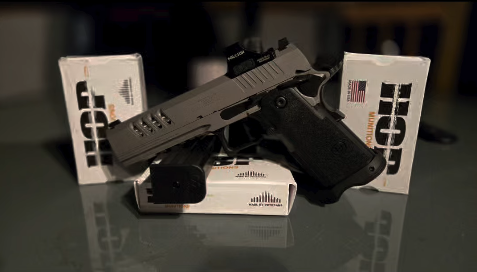 9mm pistol displayed with HOP Munitions White Box ammunition